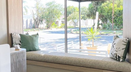 Cozy window seating at Jacqui J Beauty Salon, Johannesburg, Gauteng, ZA, offering relaxing views.
