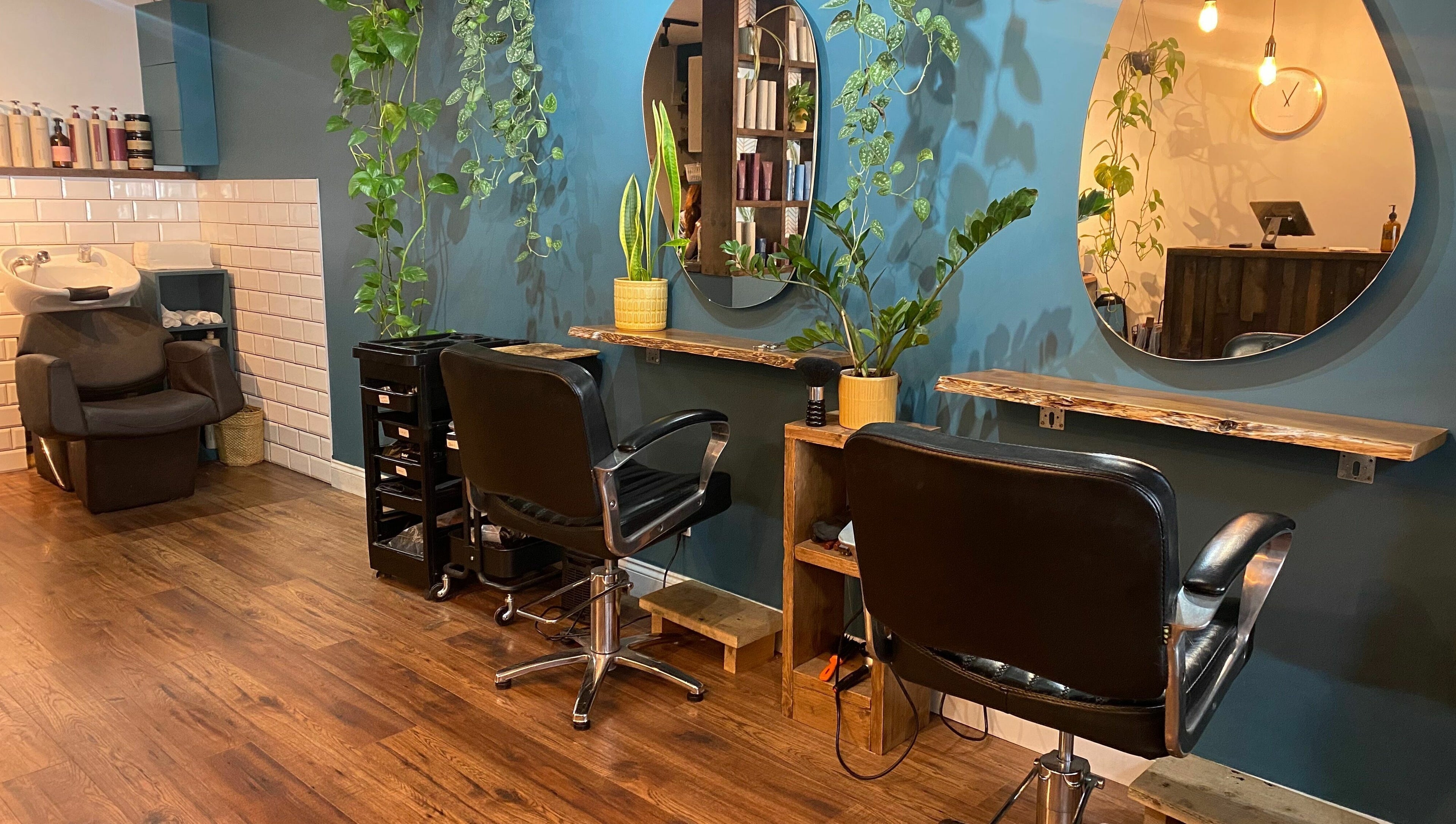 Stylish salon interior at Lazarus Hair, Brighton, England, GB with modern decor and elegant chairs.