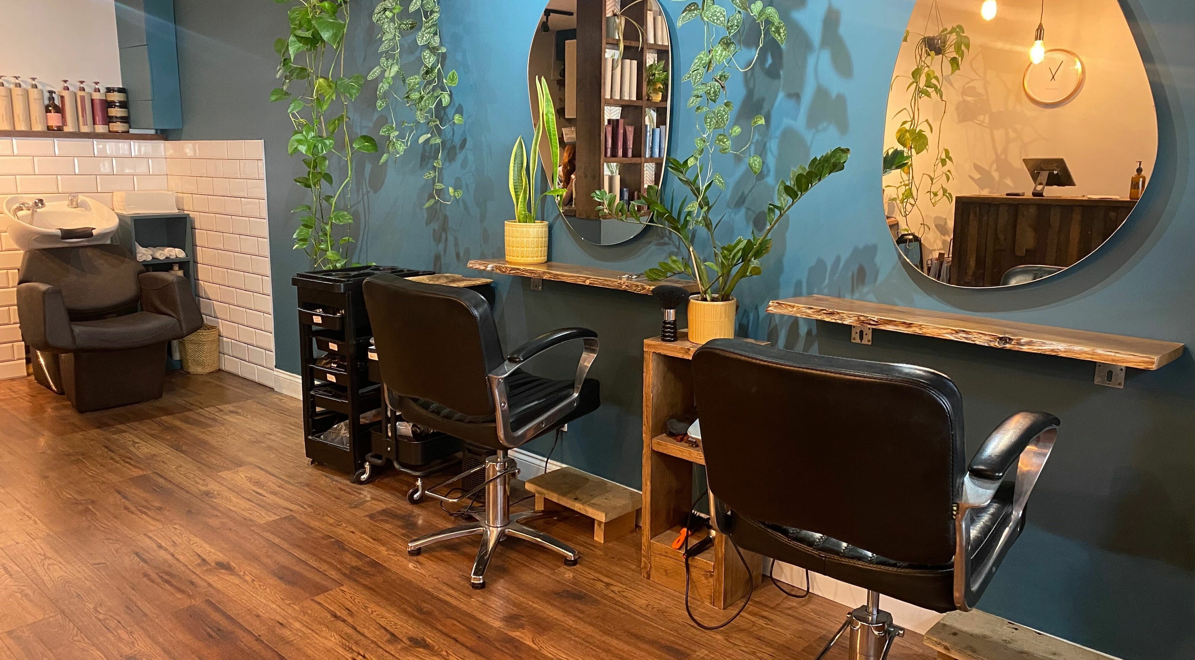 Stylish salon interior at Lazarus Hair, Brighton, England, GB with modern decor and elegant chairs.