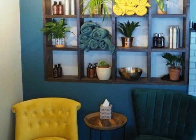 Stylish shelves and seating at Lazarus Hair, Brighton, England, GB enhance the modern ambiance.