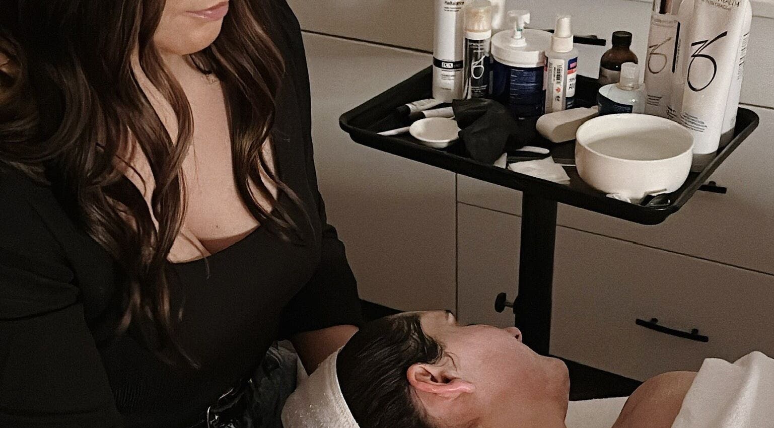 Relaxing facial treatment at Skin Deep Medical Aesthetics in Carlyle, Saskatchewan, CA with skincare products.