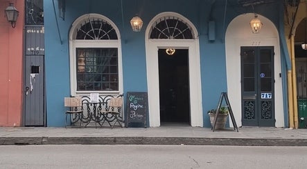 Entrance to Sirena's Psychic Parleure in New Orleans, Louisiana, US, showcasing charming outdoor seating.