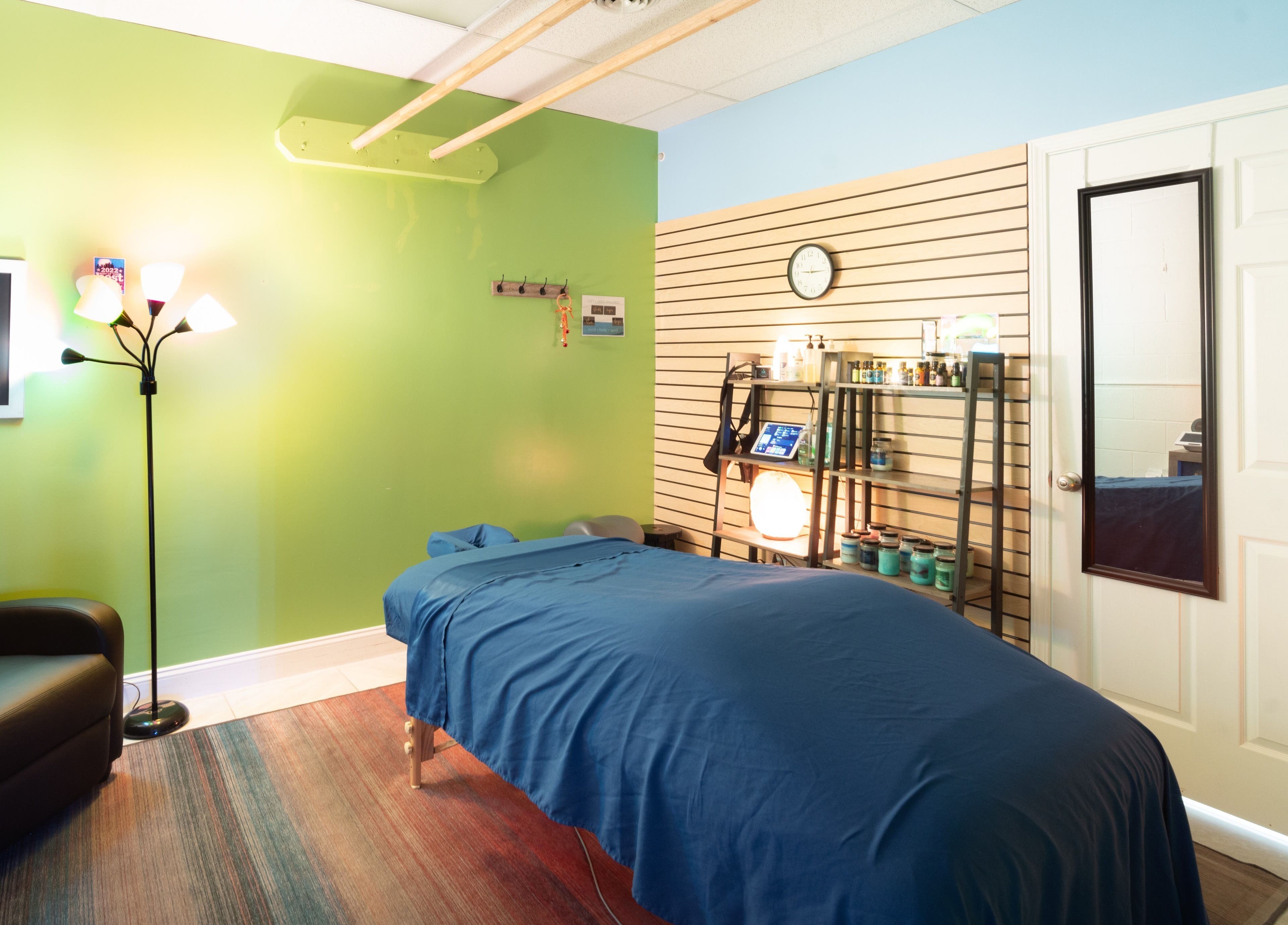 Tranquil massage room at The Zen Zone Wellness - Middletown, Blue Ridge Manor, Kentucky, US with cozy decor.