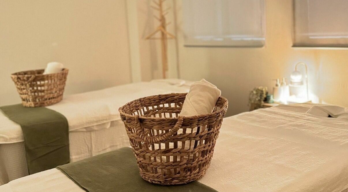 Cozy massage room at Chanan Thai Massage, Melbourne, Victoria, AU, featuring woven baskets and tranquil lighting.