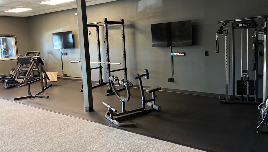 Spacious workout area at TNT Personal Training Studio in Duluth, Georgia, US, featuring advanced gym equipment.