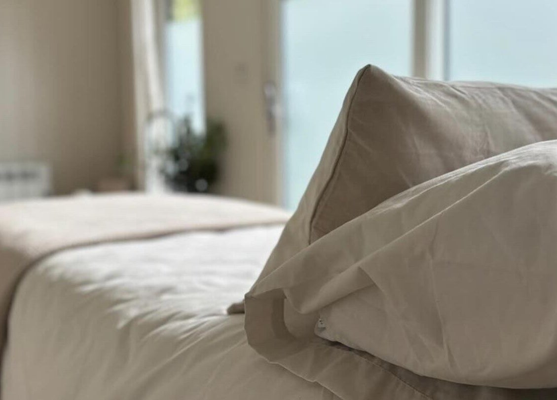 Tranquil bedroom with soft linens at Tŷ Harddwch, Boduan, Wales, GB, promoting relaxation and wellness.