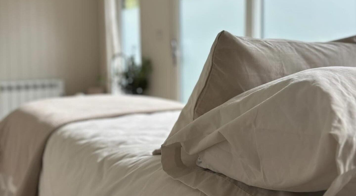 Tranquil bedroom with soft linens at Tŷ Harddwch, Boduan, Wales, GB, promoting relaxation and wellness.