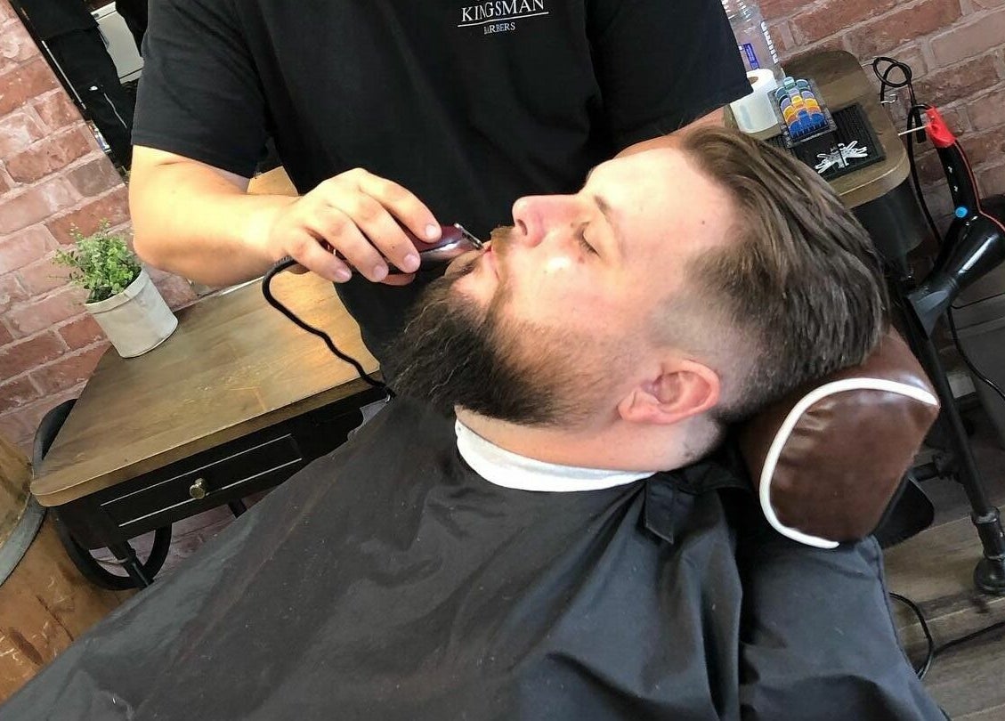 Barber grooming beard at Carlisle St in Balaclava (Opposite Woolworths), Melbourne, Victoria, AU.