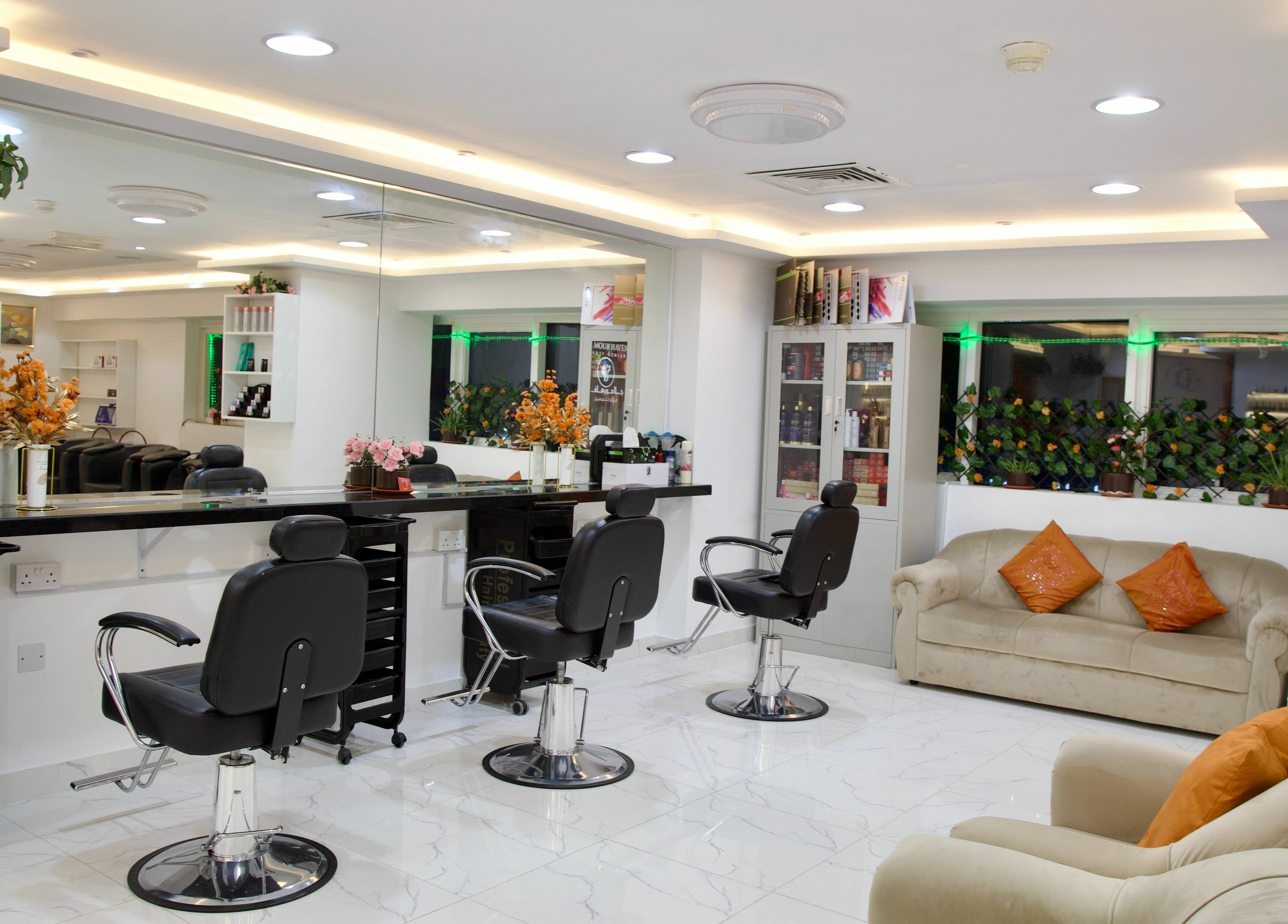 Modern salon interior at Glamour Haven Beauty Center in Abu Dhabi, Abu Dhabi, AE with stylish chairs and decor.