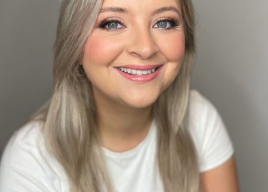 A smiling person showcasing makeup by INSKA Make Up Artist, Edinburgh, Scotland, GB.