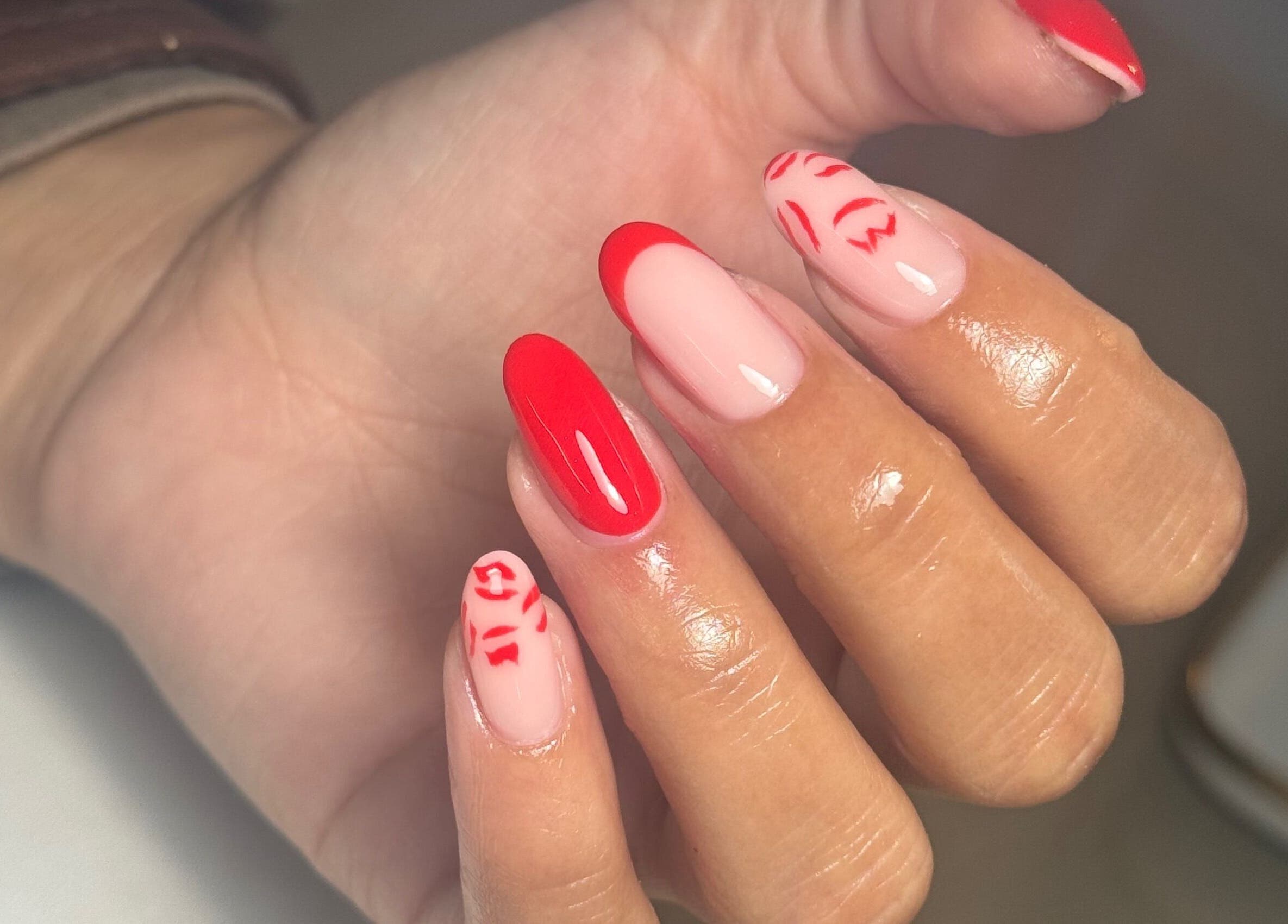 Elegant red and nude nail art at Biabbarr, Cardiff, Wales, GB. Perfect for a stylish look.