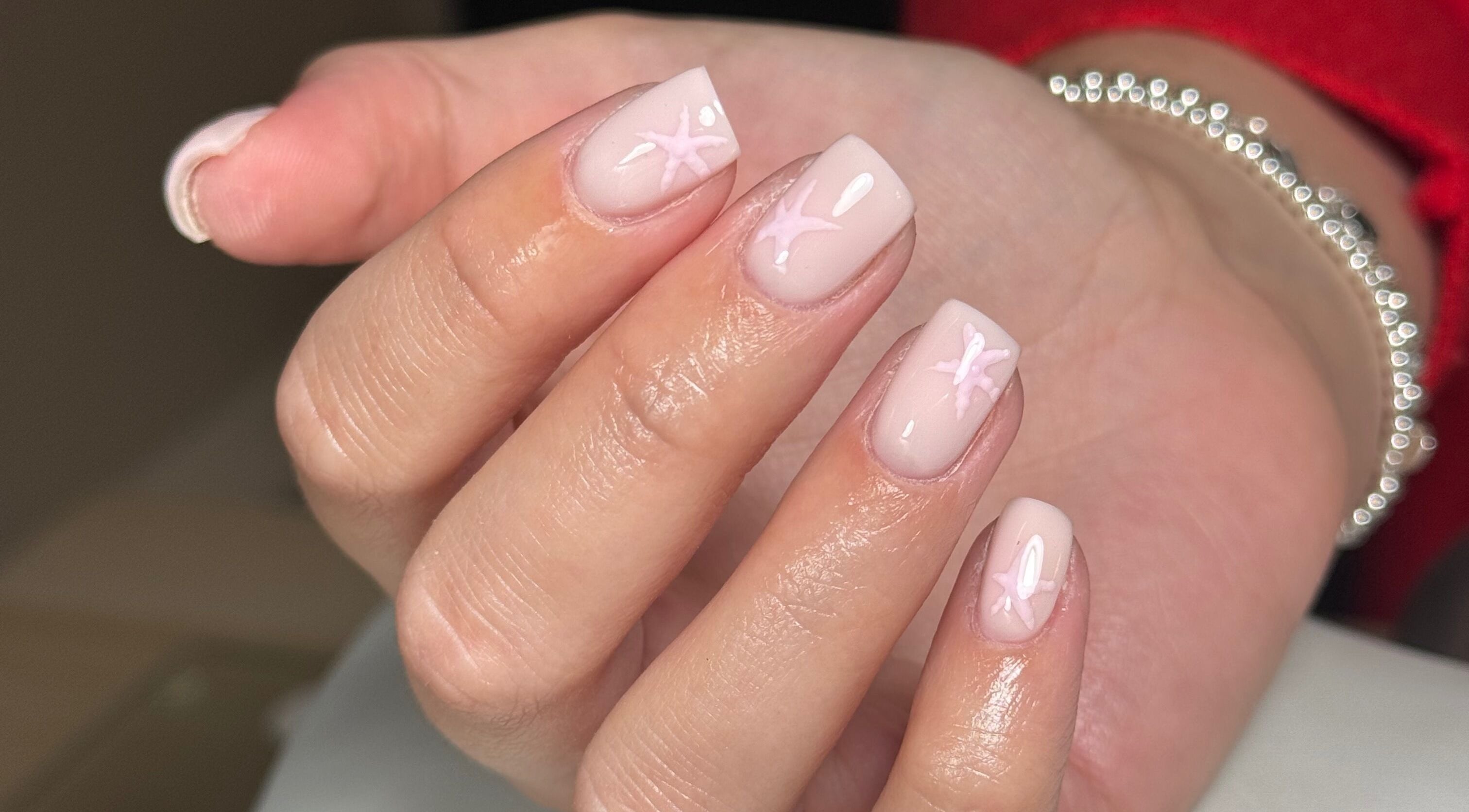 Close-up of elegant nail art with star designs at Biabbarr, Cardiff, Wales, GB.