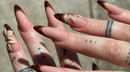 Elegant nail art with brown tips at The Suga House Nail Artistry, Melbourne, Victoria, AU.