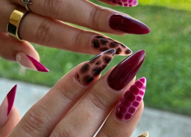 The Suga House Nail Artistry showcases vibrant nail designs in Melbourne, Victoria, AU, featuring unique patterns.