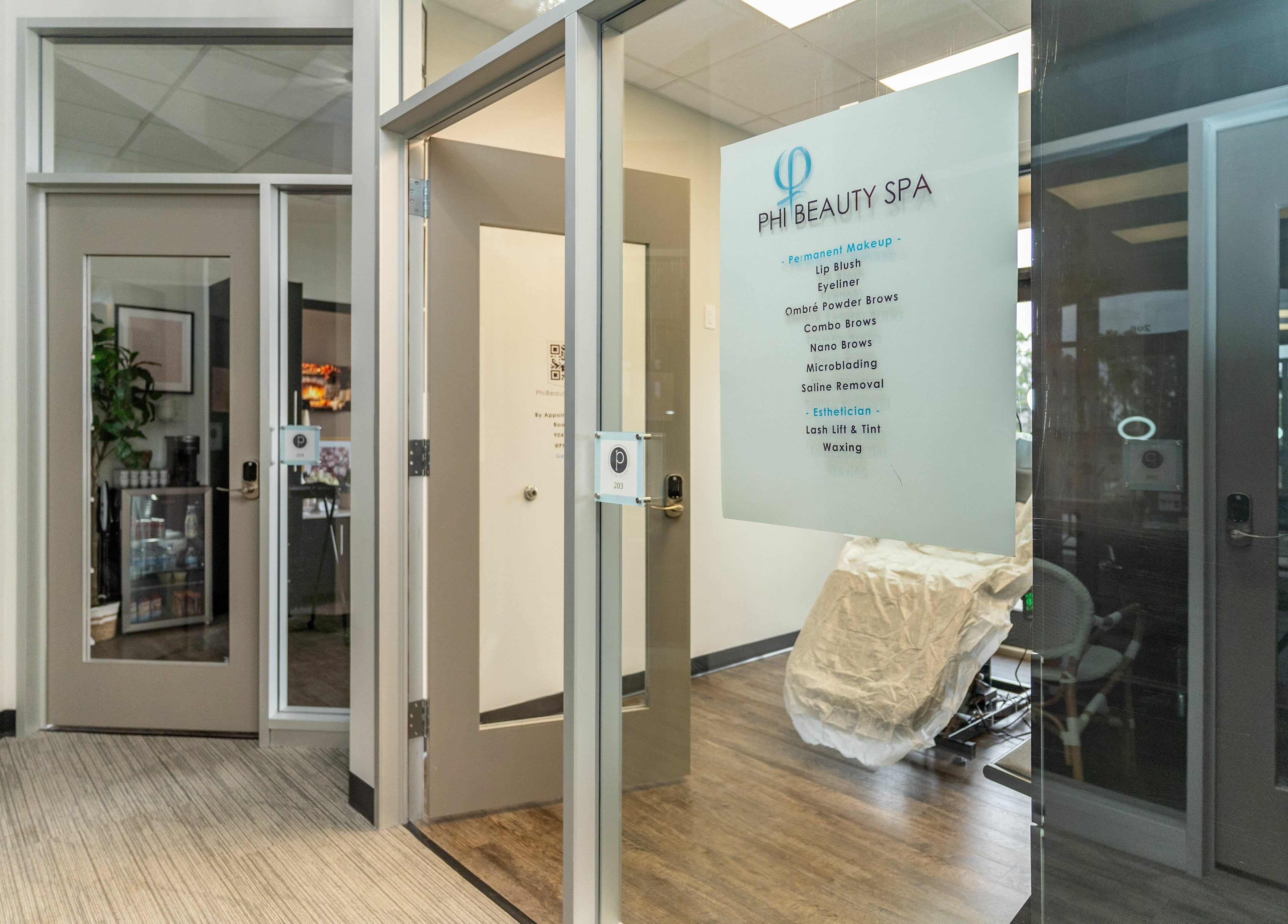 Elegant entrance of Phi Beauty Spa - Total Salons Unit #126 at Neptune Beach, Florida, US with bright interior.