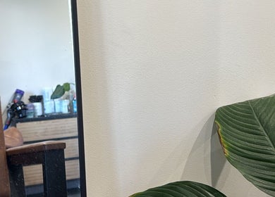 Relaxing salon corner at Hair by Jaz, Catalina, New South Wales, AU with plants and cozy seating.