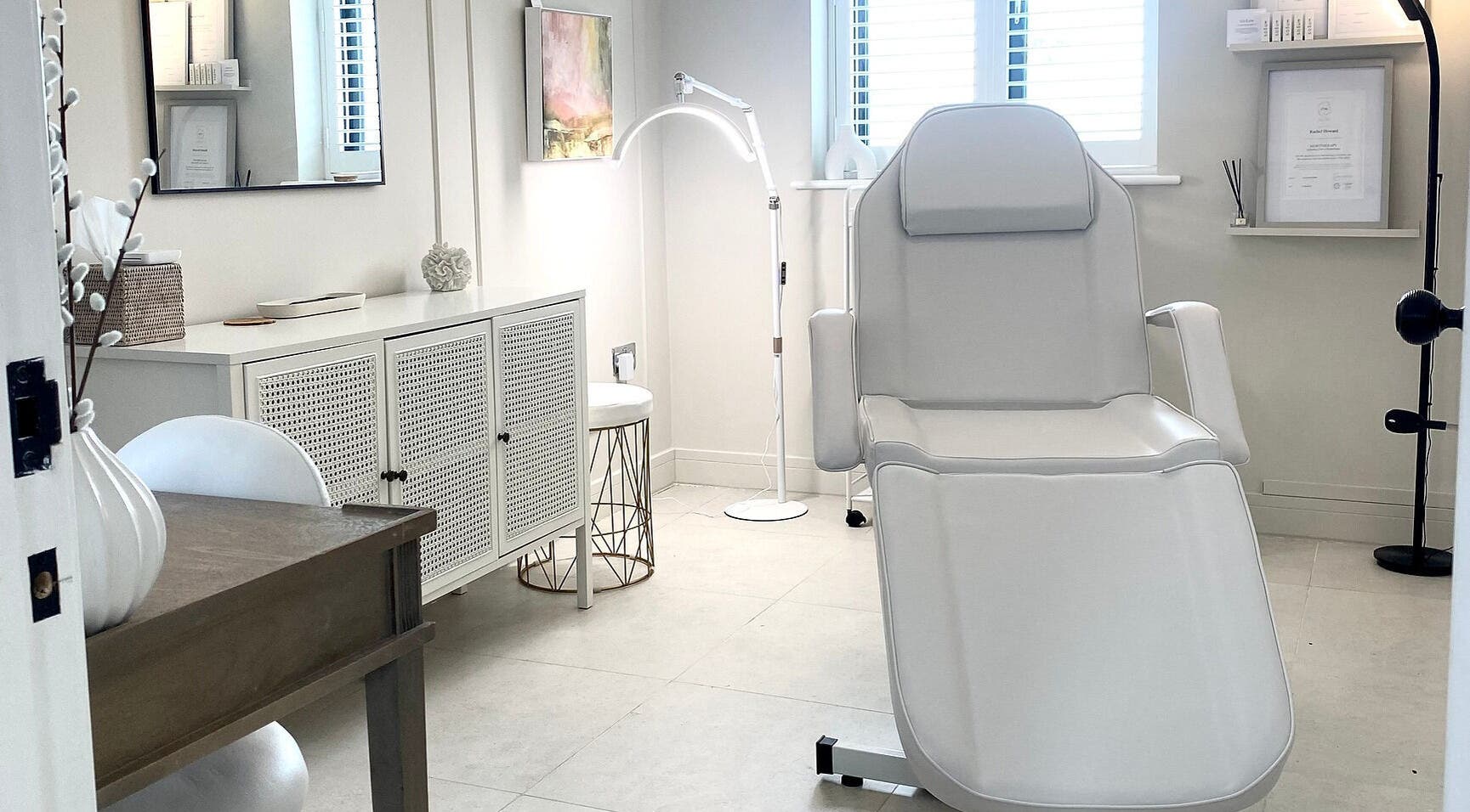Elegant treatment room at R Skin Aesthetics, Evesham, England, GB with modern decor and comfortable chair.