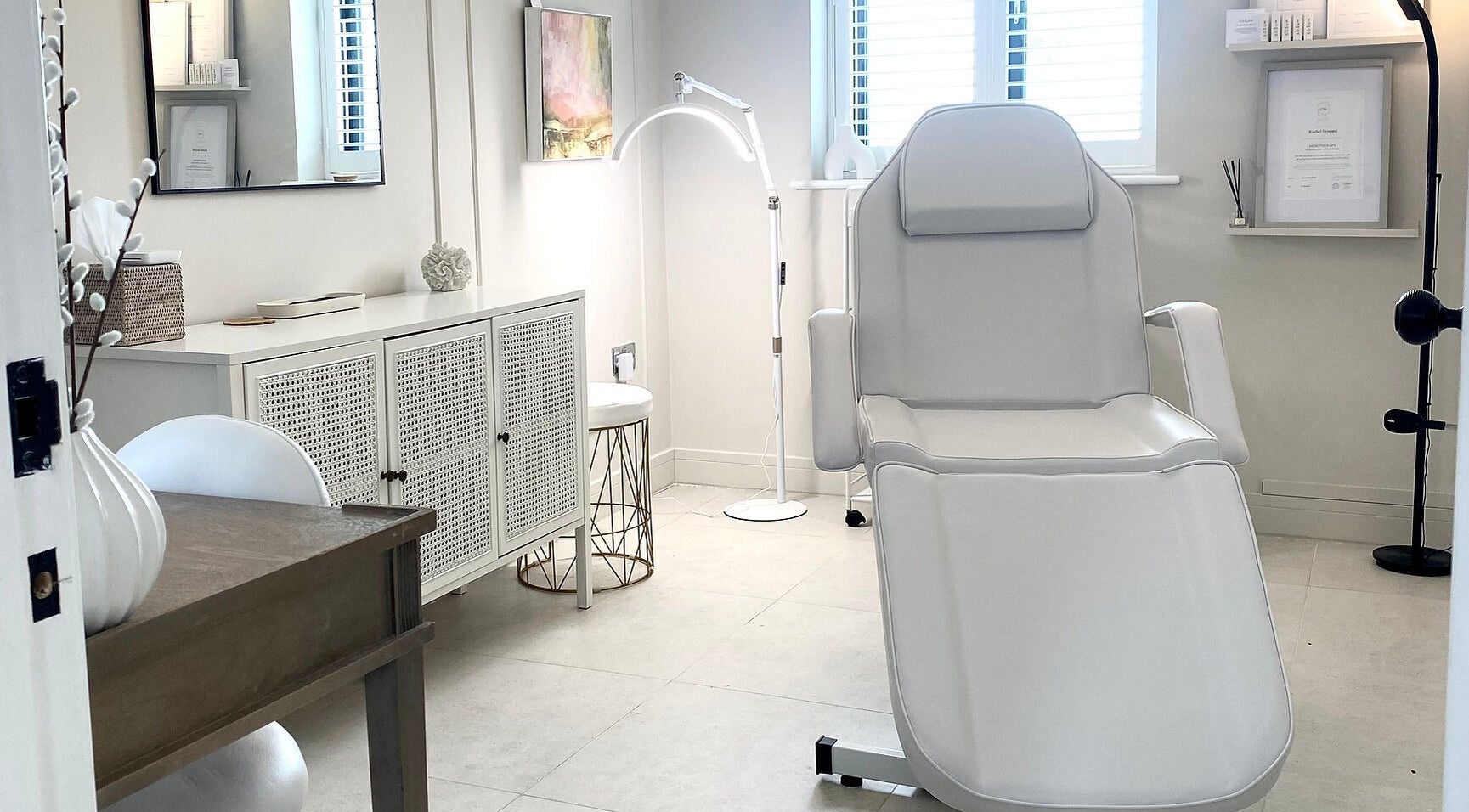 Elegant treatment room at R Skin Aesthetics, Evesham, England, GB with modern decor and comfortable chair.