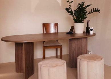 Elegant wooden desk with a plant at By Chan Bodycare, Amsterdam, Noord-Holland, NL.
