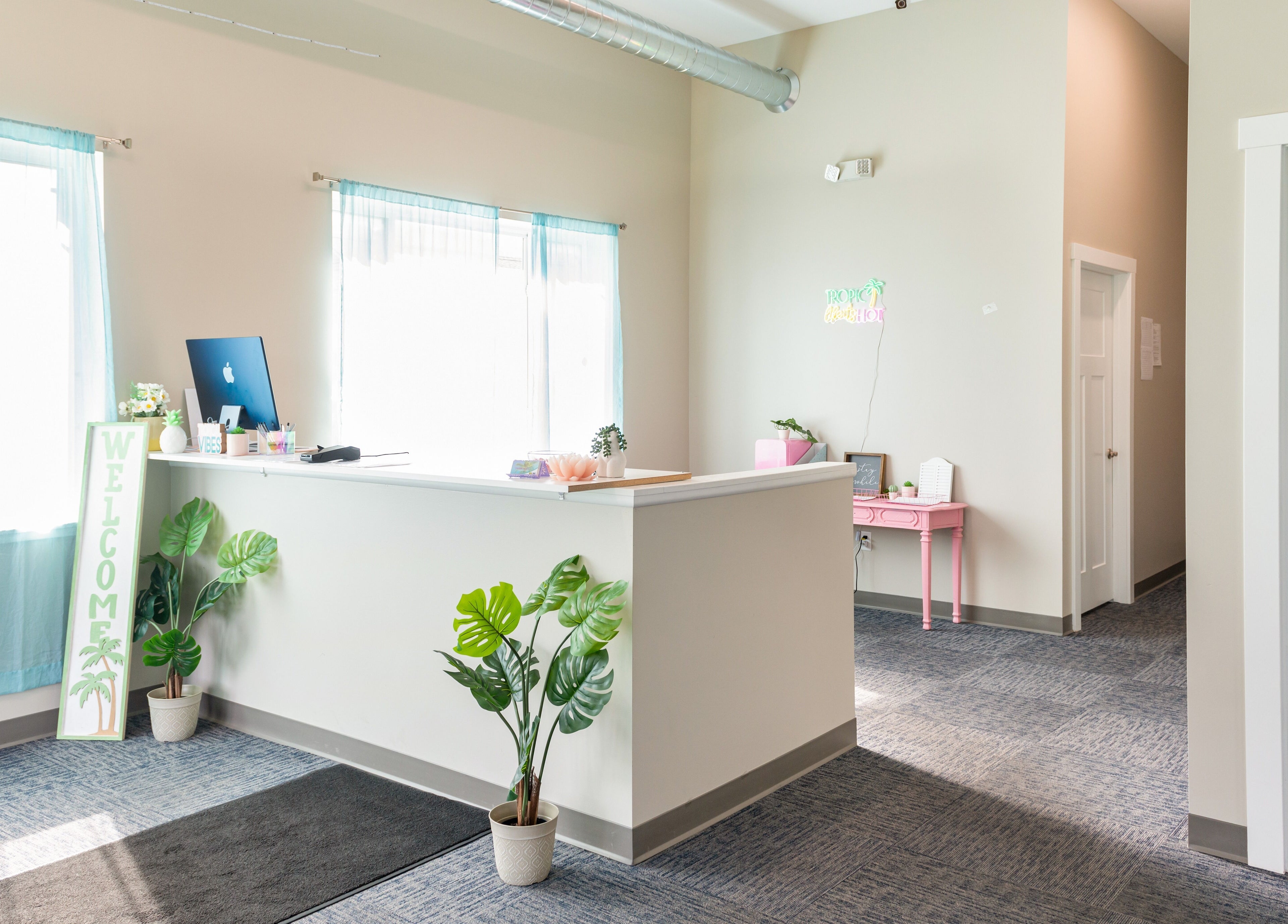 Bright welcoming lobby at Tropical Touch Spa in Jenison, Michigan, US with modern decor and relaxing ambiance.