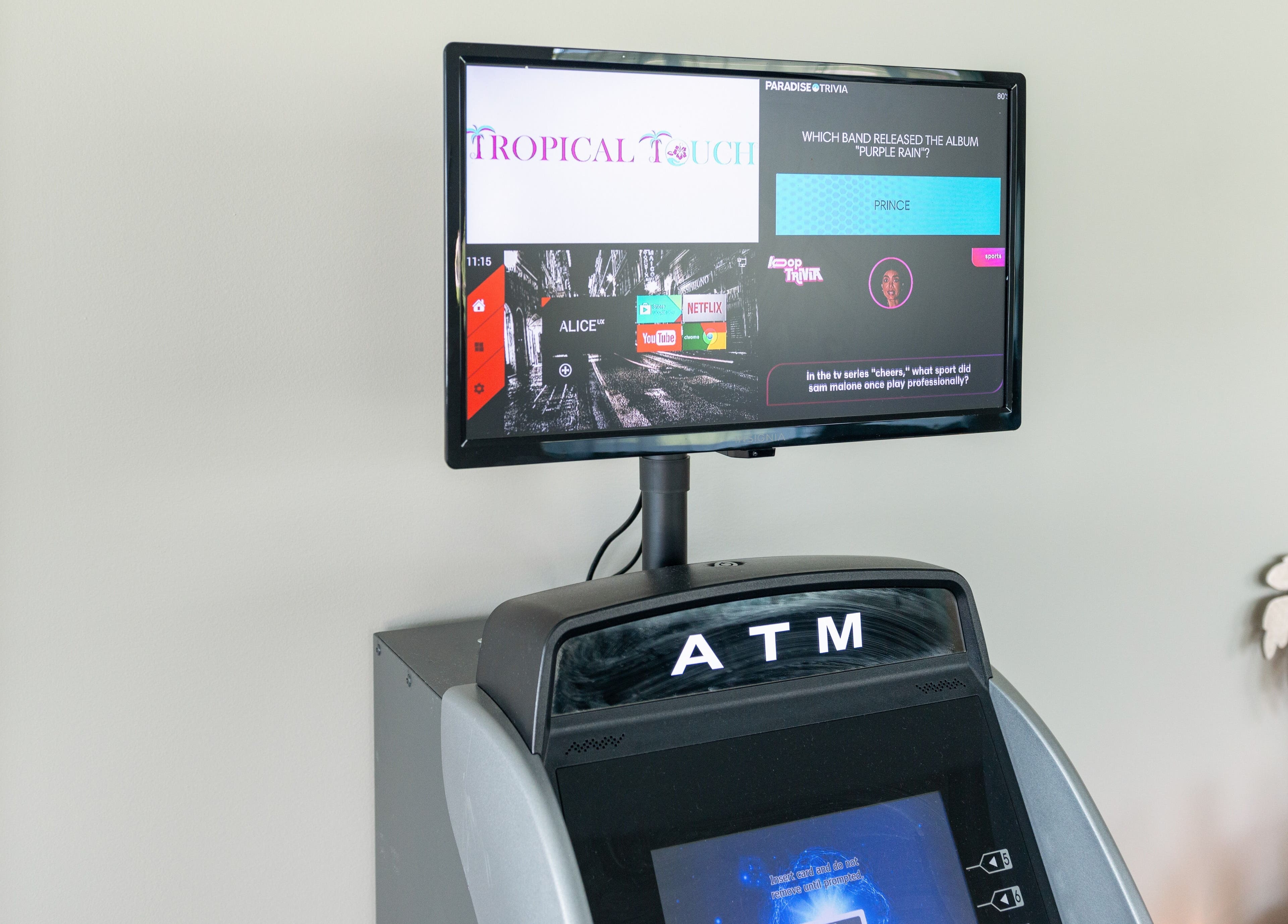 ATM and screen setup at Tropical Touch Spa, Jenison, Michigan, US, offering convenience for guests.