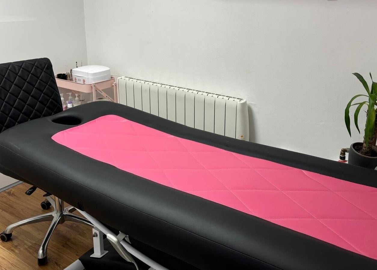 Massage table in pink and black at Bossy Nails and Beauty Spa, Ennis, County Clare, IE. Relaxation awaits.