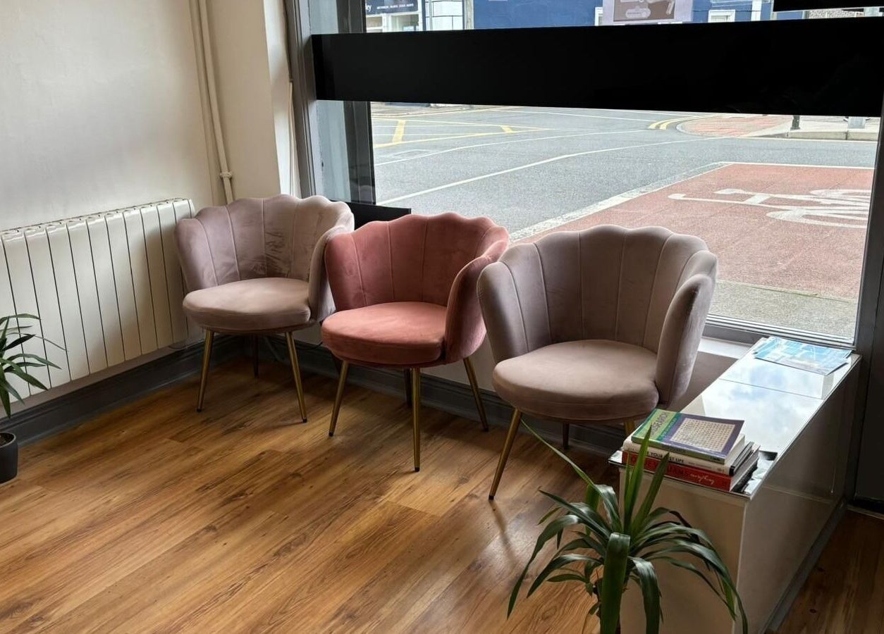 Chic seating area at Bossy Nails and Beauty Spa, Ennis, County Clare, IE with plush chairs and stylish decor.