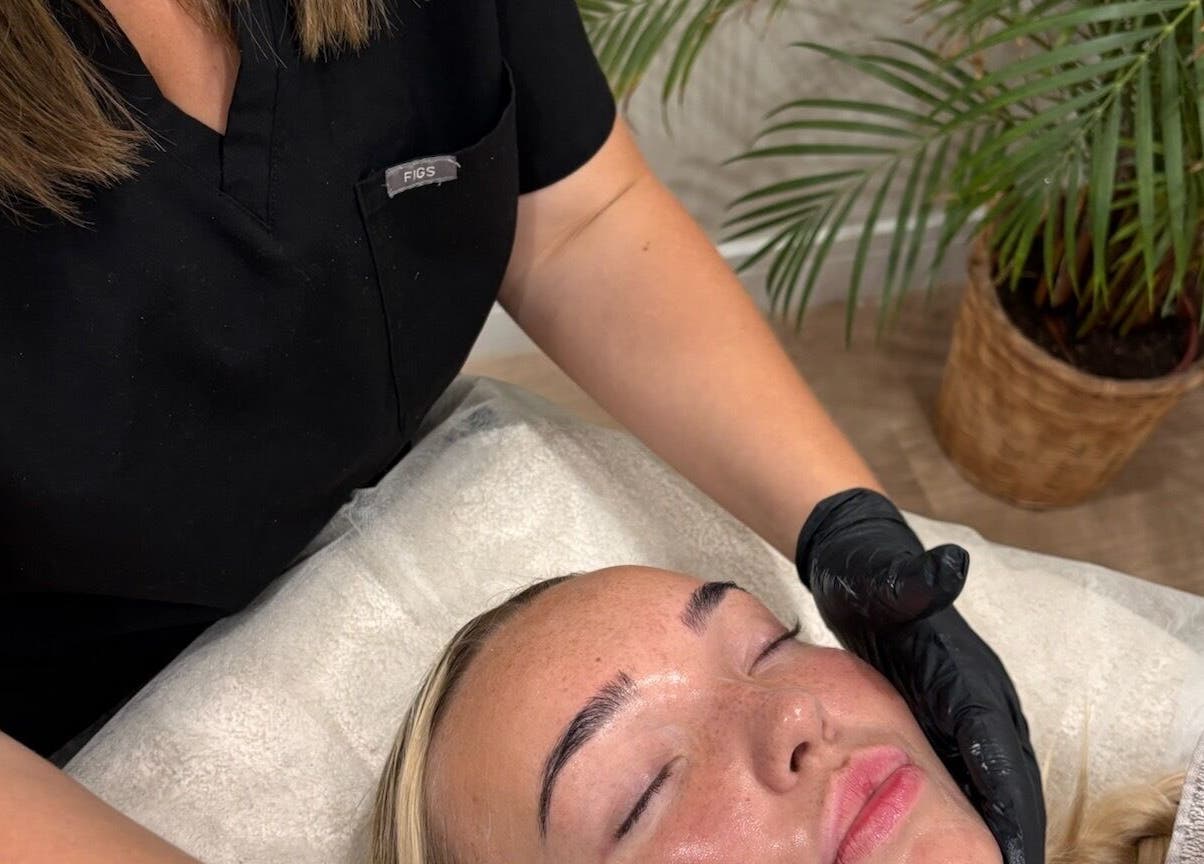 Facial treatment at Haus of Glow @ The Beauty Spot, Sandbach, England, GB. Woman receiving relaxing skincare therapy.