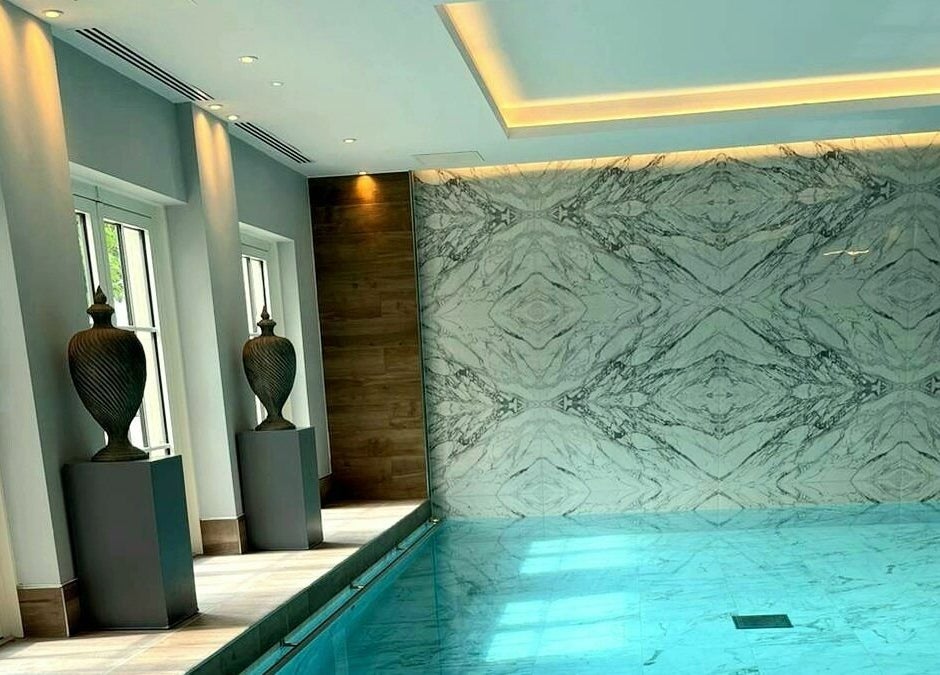 Luxurious indoor pool with marble decor at The Hampton Spa, Failand, England, GB.