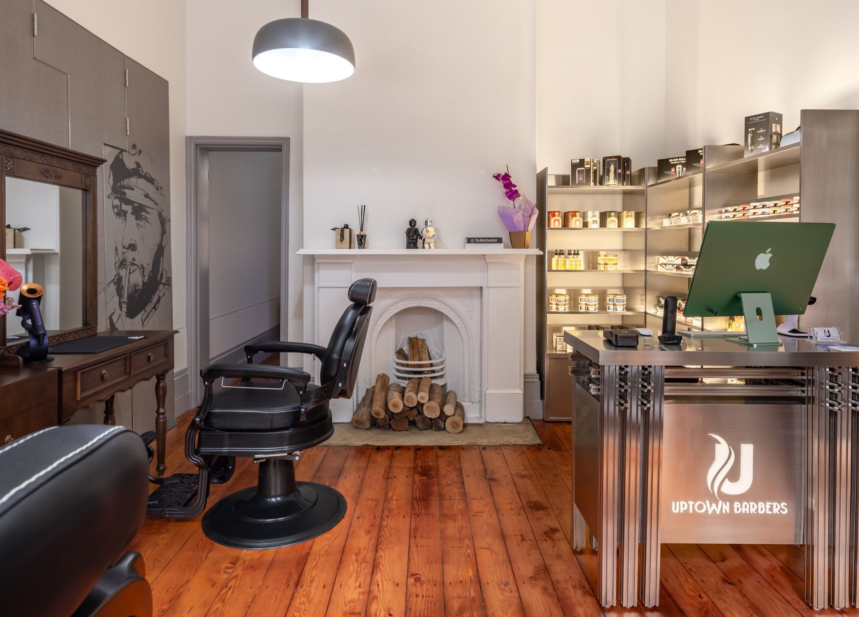 Elegant interior of Uptown Barbers The Rocks, New South Wales, AU, featuring vintage decor and wood accents.