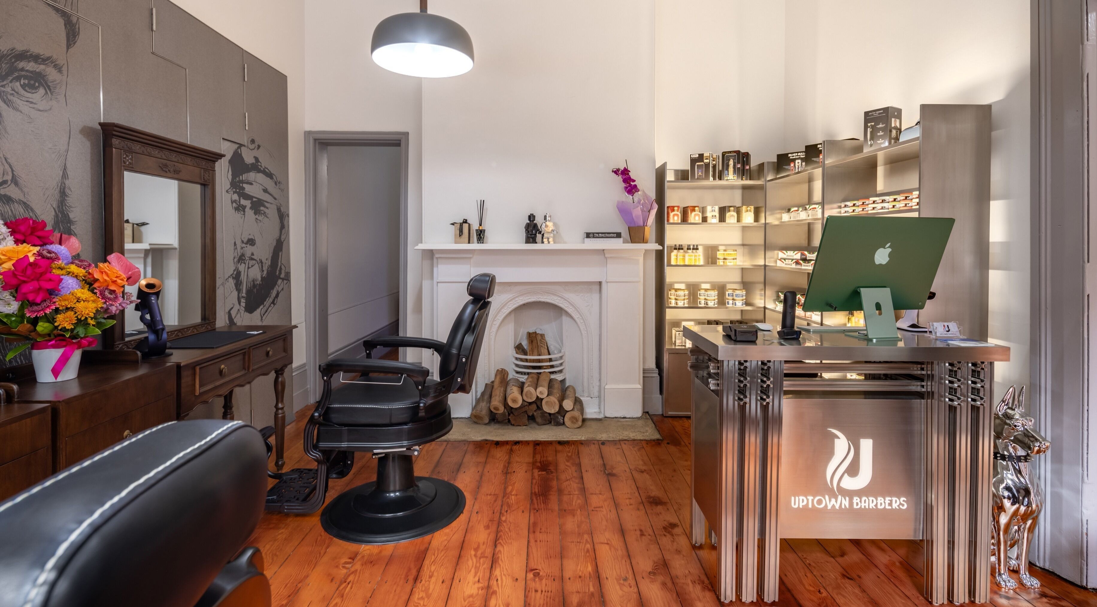 Elegant interior of Uptown Barbers The Rocks, New South Wales, AU, featuring vintage decor and wood accents.