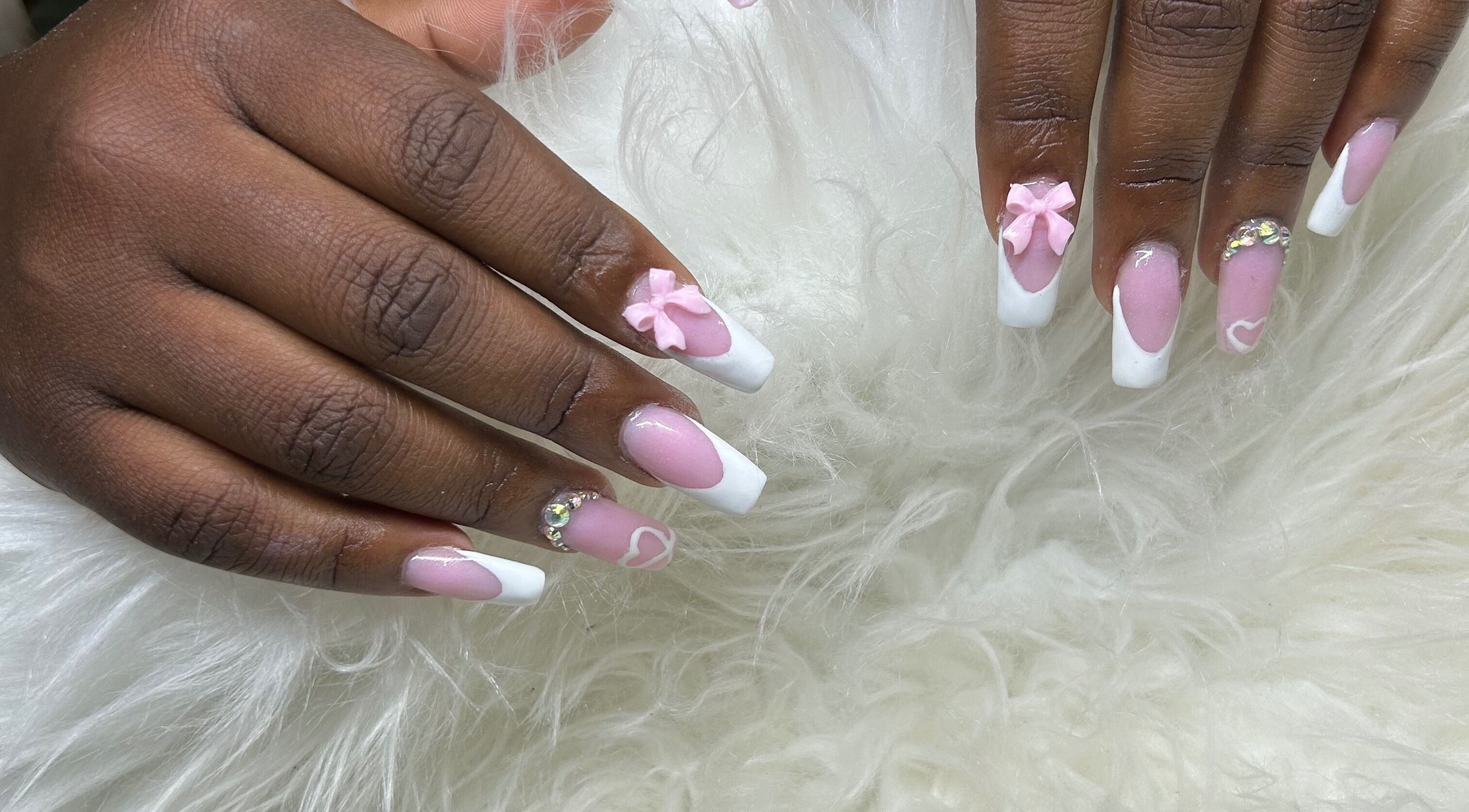 Elegant pink and white nail art with bows at Becs Beauty Lab, Nassau, New Providence, BS.