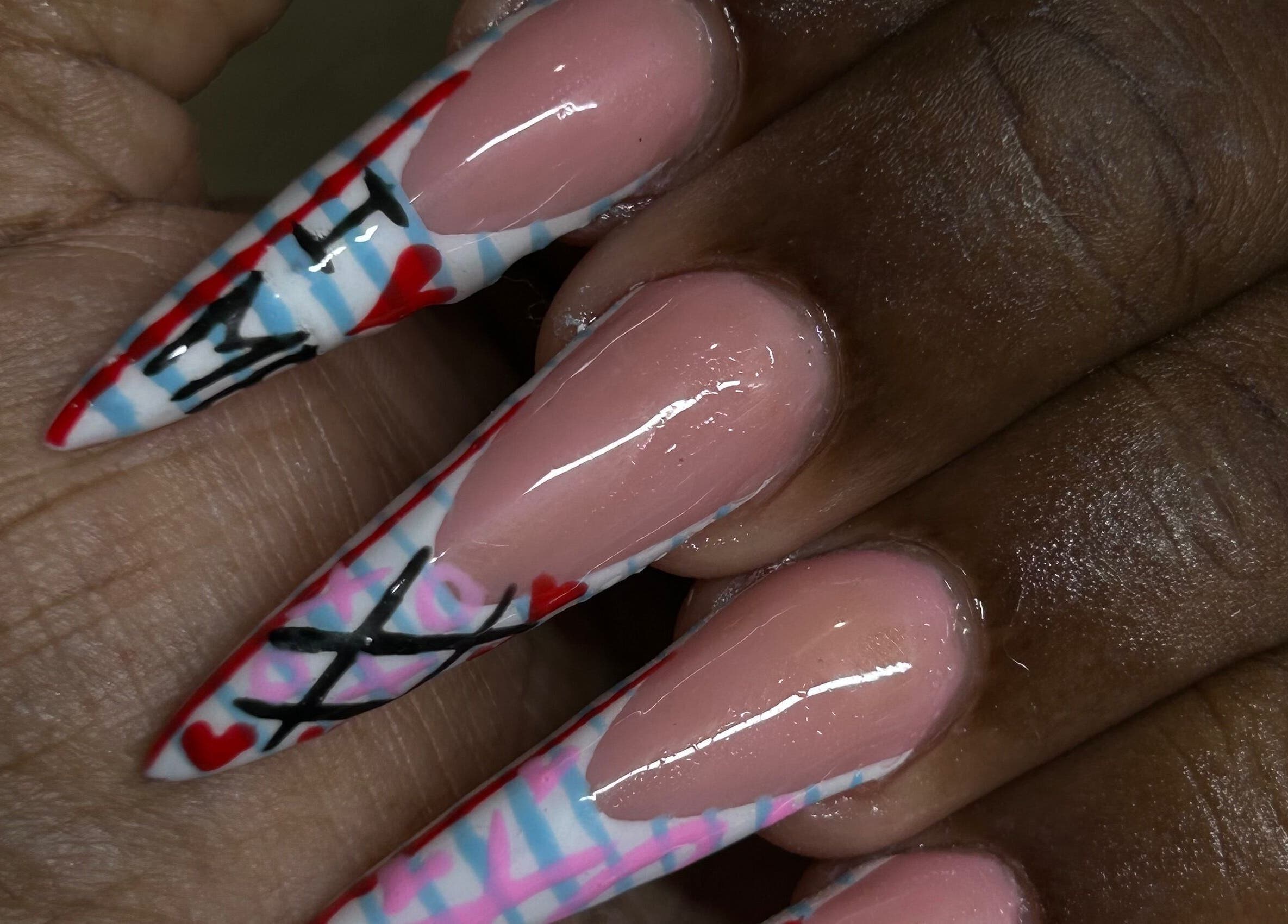 Intricate nail art at Becs Beauty Lab, Nassau, New Providence, BS featuring unique patterns and colors.