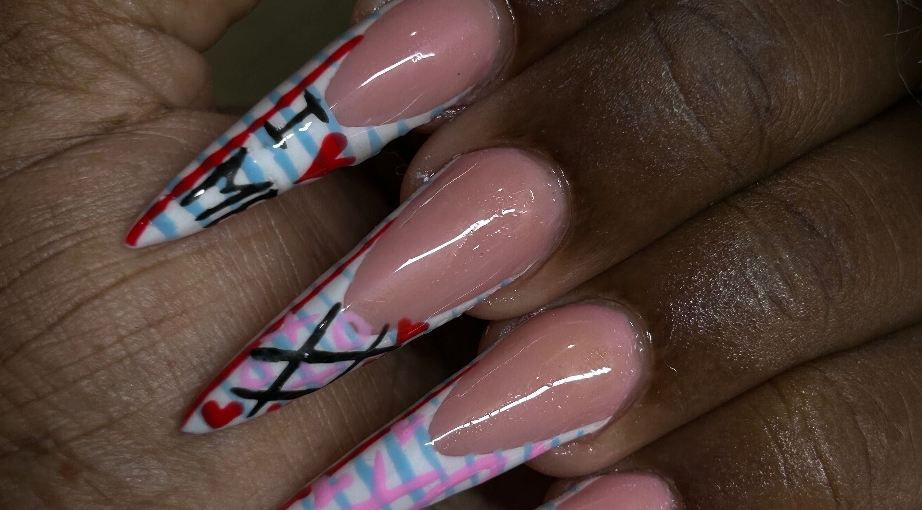 Intricate nail art at Becs Beauty Lab, Nassau, New Providence, BS featuring unique patterns and colors.