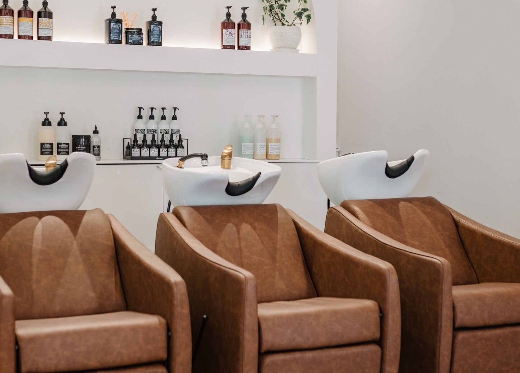 Elegant salon chairs and wash stations at Mooi Studio, Glenelg, South Australia, AU.