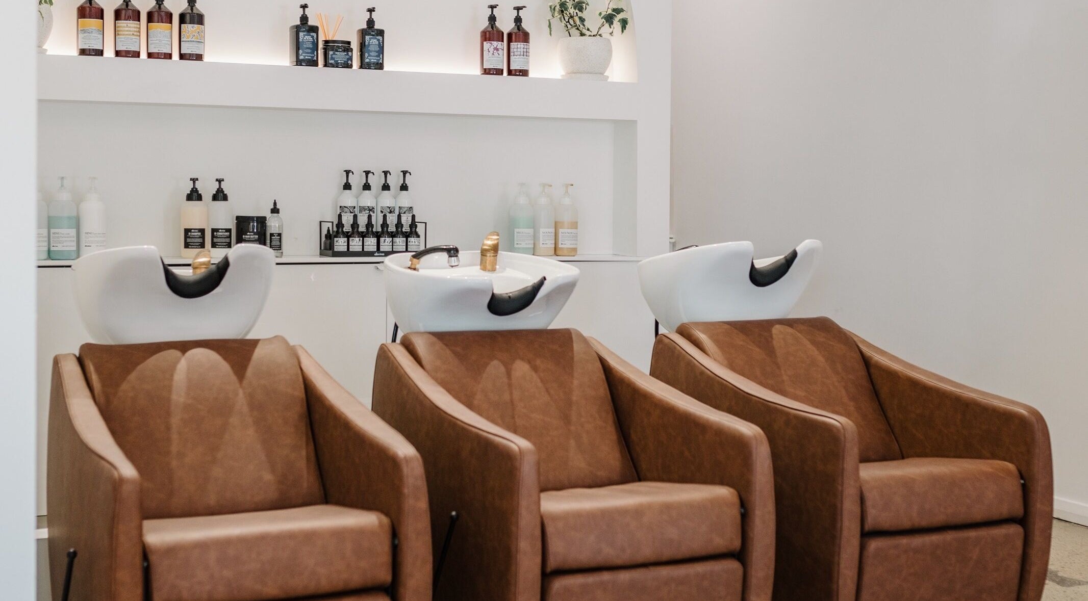Elegant salon chairs and wash stations at Mooi Studio, Glenelg, South Australia, AU.