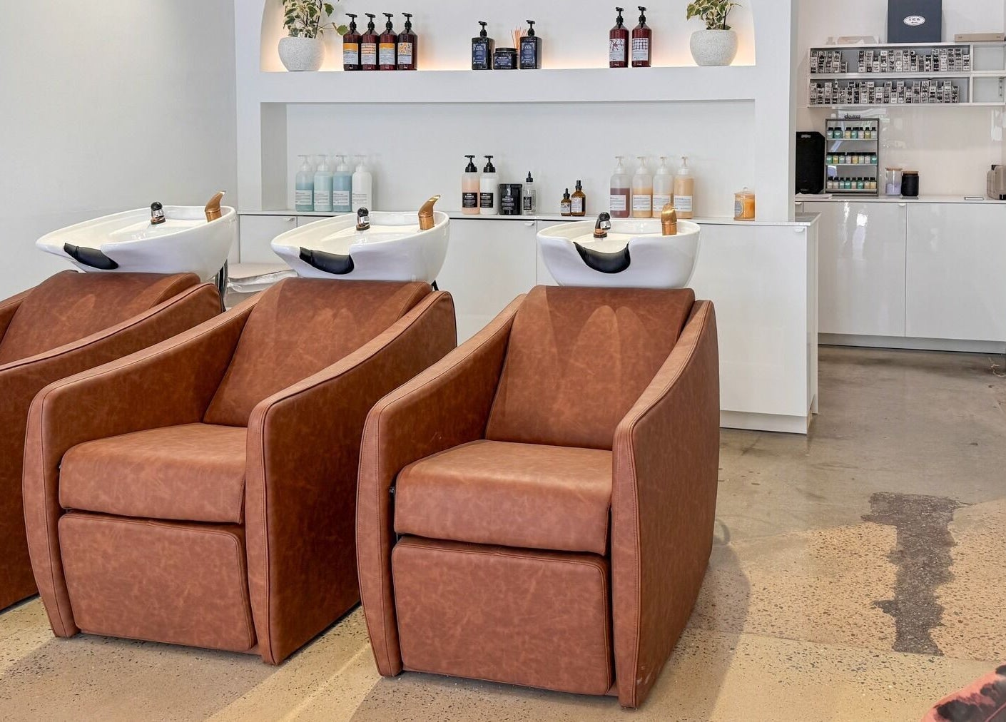 Luxurious hair wash station with leather chairs at Mooi Studio, Glenelg, South Australia, AU.