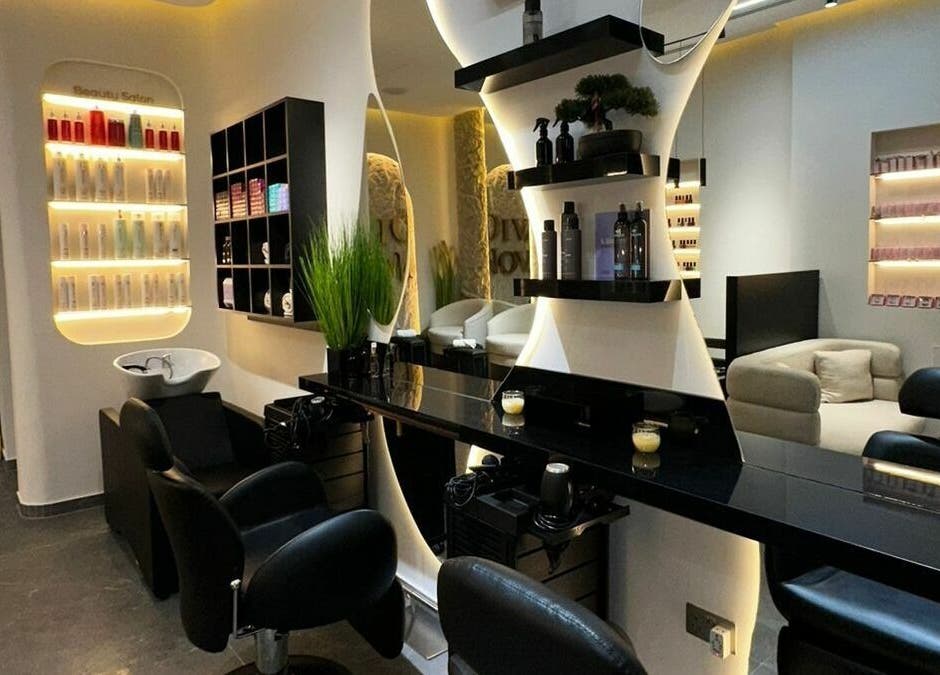 Modern interior of Diva Nova Beauty Salon in Dubai, Dubai, AE, showcasing sleek decor and styling stations.