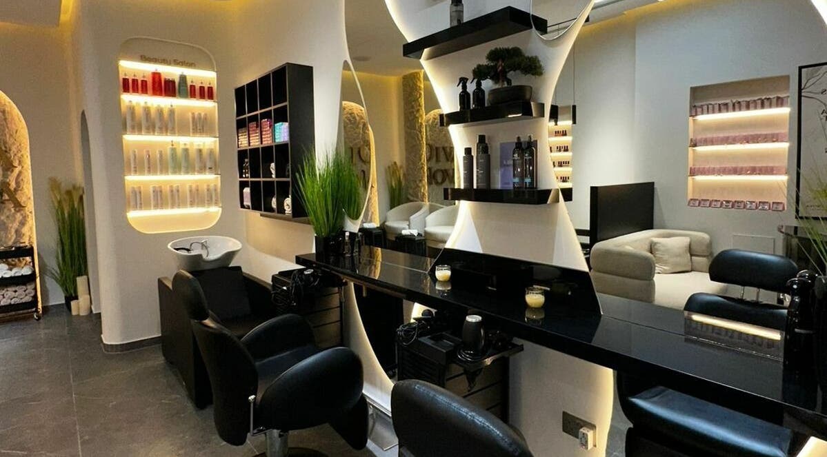 Modern interior of Diva Nova Beauty Salon in Dubai, Dubai, AE, showcasing sleek decor and styling stations.