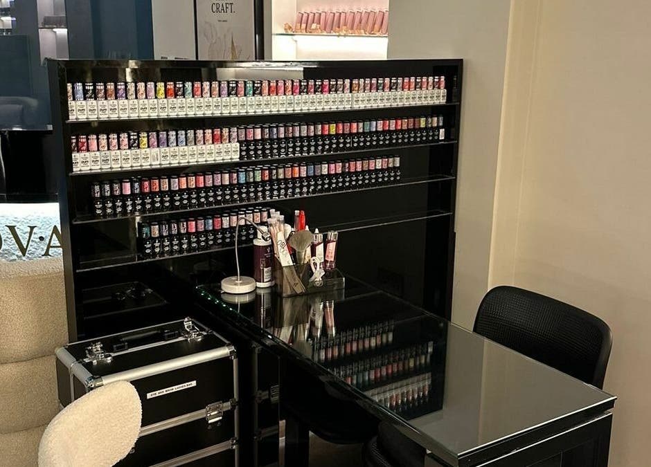 Elegant nail station at Diva Nova Beauty Salon, Dubai, Dubai, AE with organized polish display.