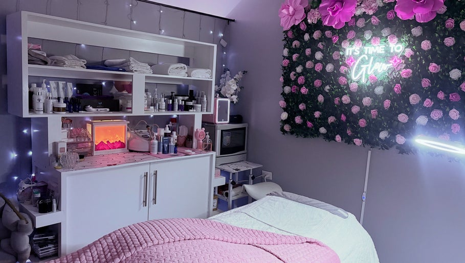 Calm treatment room at Skin Serenity Spa and Wax Studio, Tunapuna, TT with pink decor and floral accents.