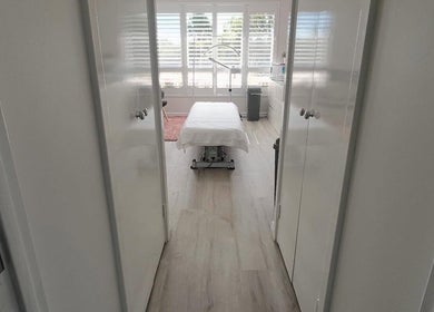 Treatment room at Beautiful Girl, Aveley, Western Australia with a massage table and calming decor.