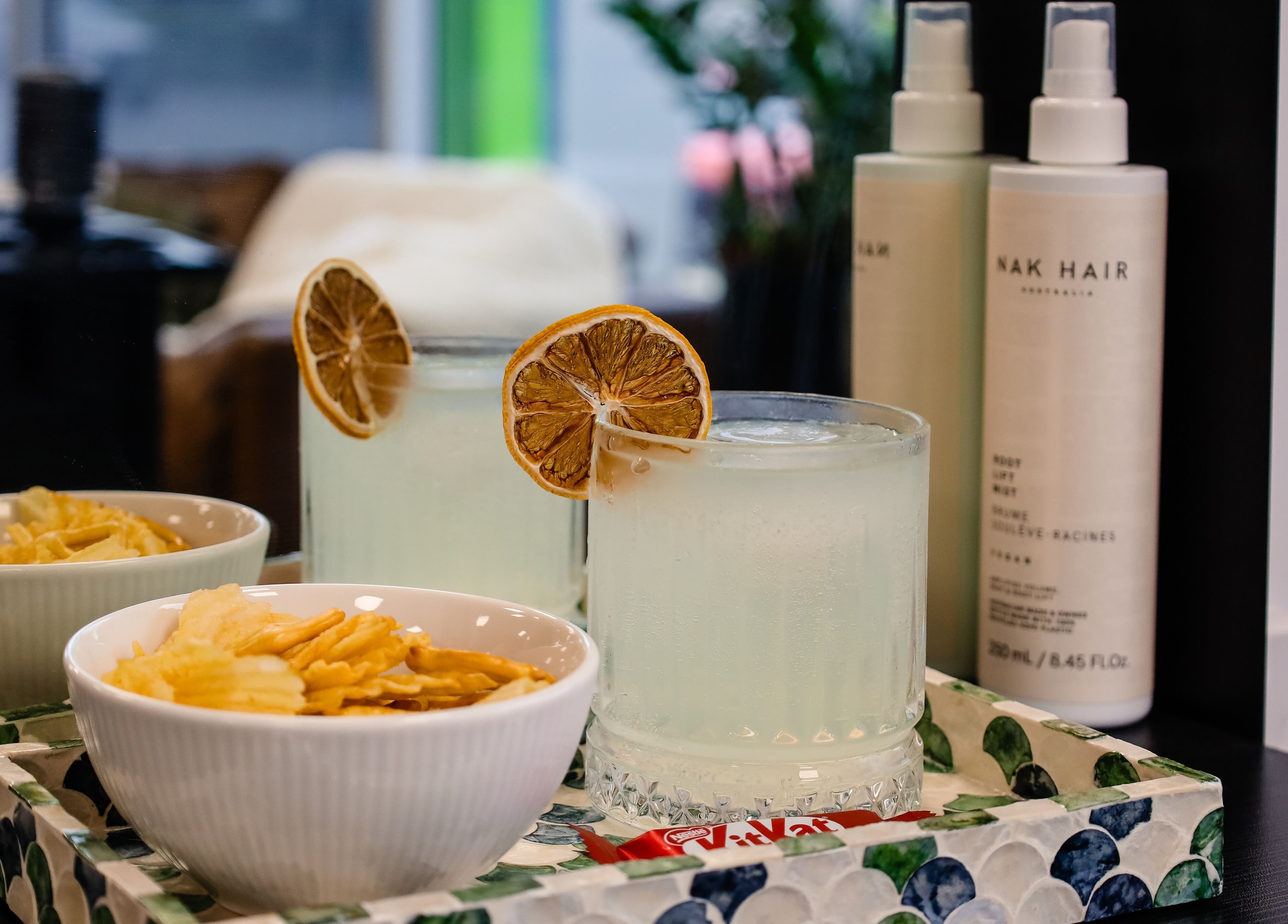 Refreshing drink and snacks at Fusion Hair, Woree, Queensland, AU, creating a luxurious salon experience.