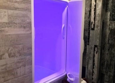 Relaxing float pod at Chesterton Mamabear Massage & Float, Chesterton, Indiana, US, set against rustic walls.