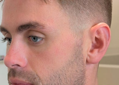 Close-up of a stylish fade haircut at Massi Aldini, Paddington, New South Wales, AU.