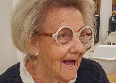 Smiling customer enjoying a visit at Massi Aldini, Paddington, New South Wales, AU.