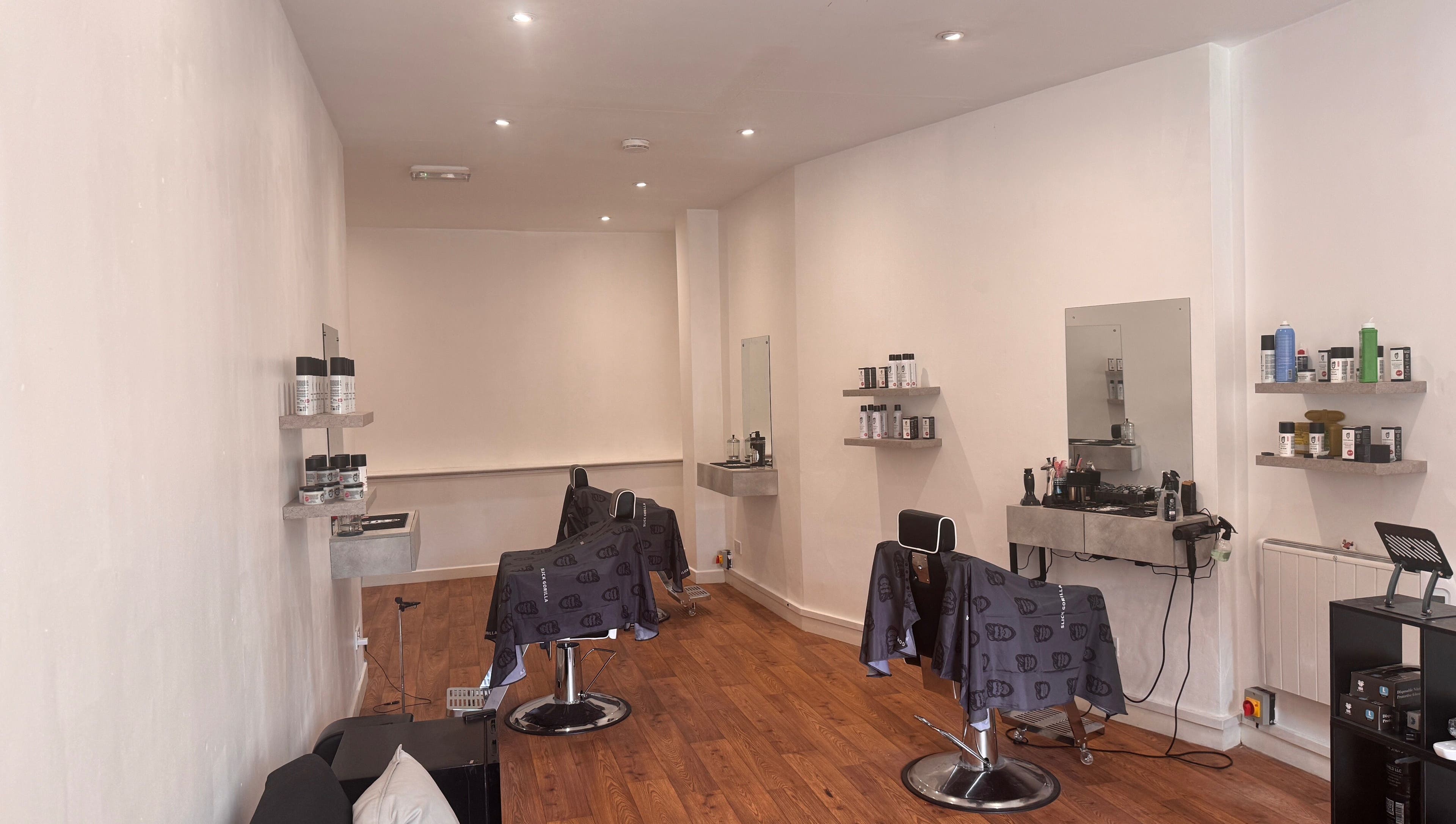 Interior view of Studio7 in Shipston-on-stour, England, showcasing modern styling chairs and beauty products.