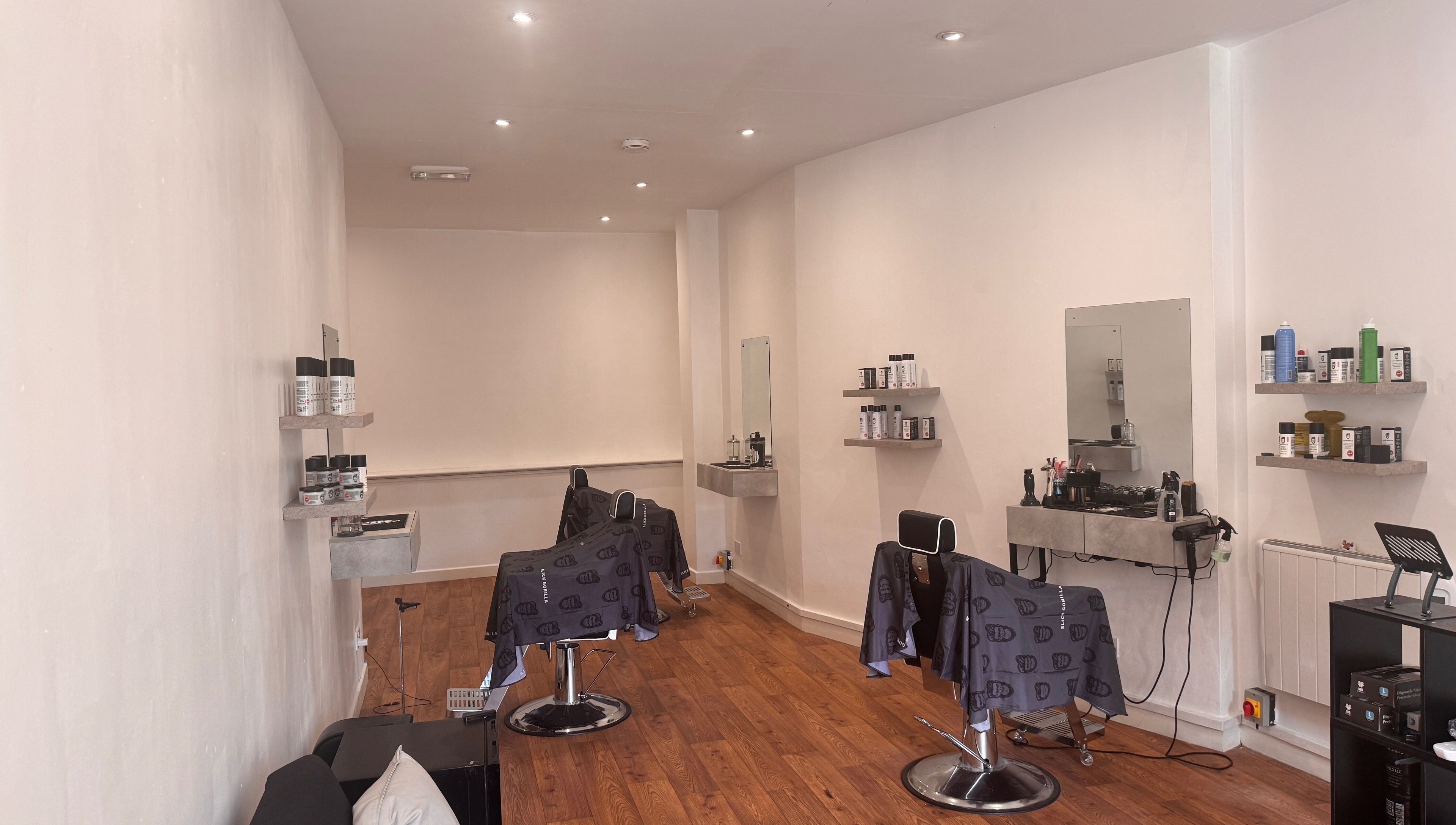 Interior view of Studio7 in Shipston-on-stour, England, showcasing modern styling chairs and beauty products.