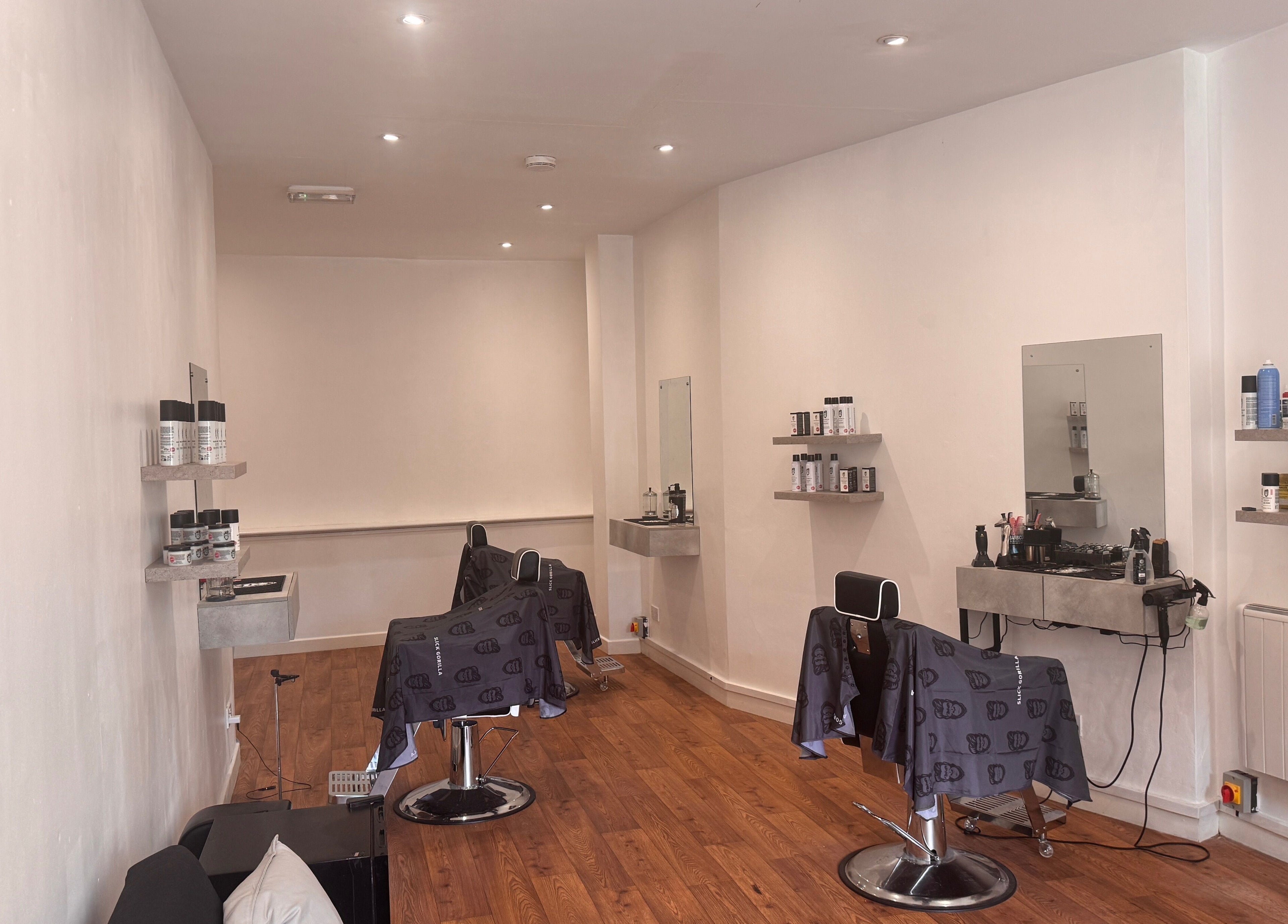 Interior view of Studio7 in Shipston-on-stour, England, showcasing modern styling chairs and beauty products.