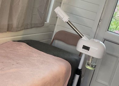 Comfortable treatment room at Tiana Hughes, Castleford, England, GB with spa bed and modern equipment.